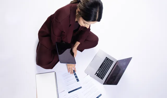 Barkha Agarwal working on a laptop, seen from above