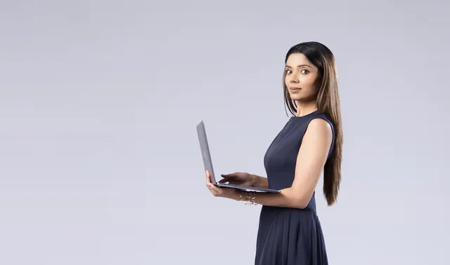 Barkha Agarwal holding a laptop